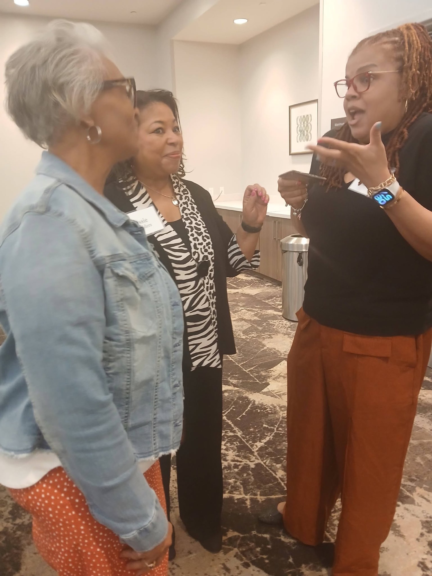 Attendees chatting at a past Be1 Experience