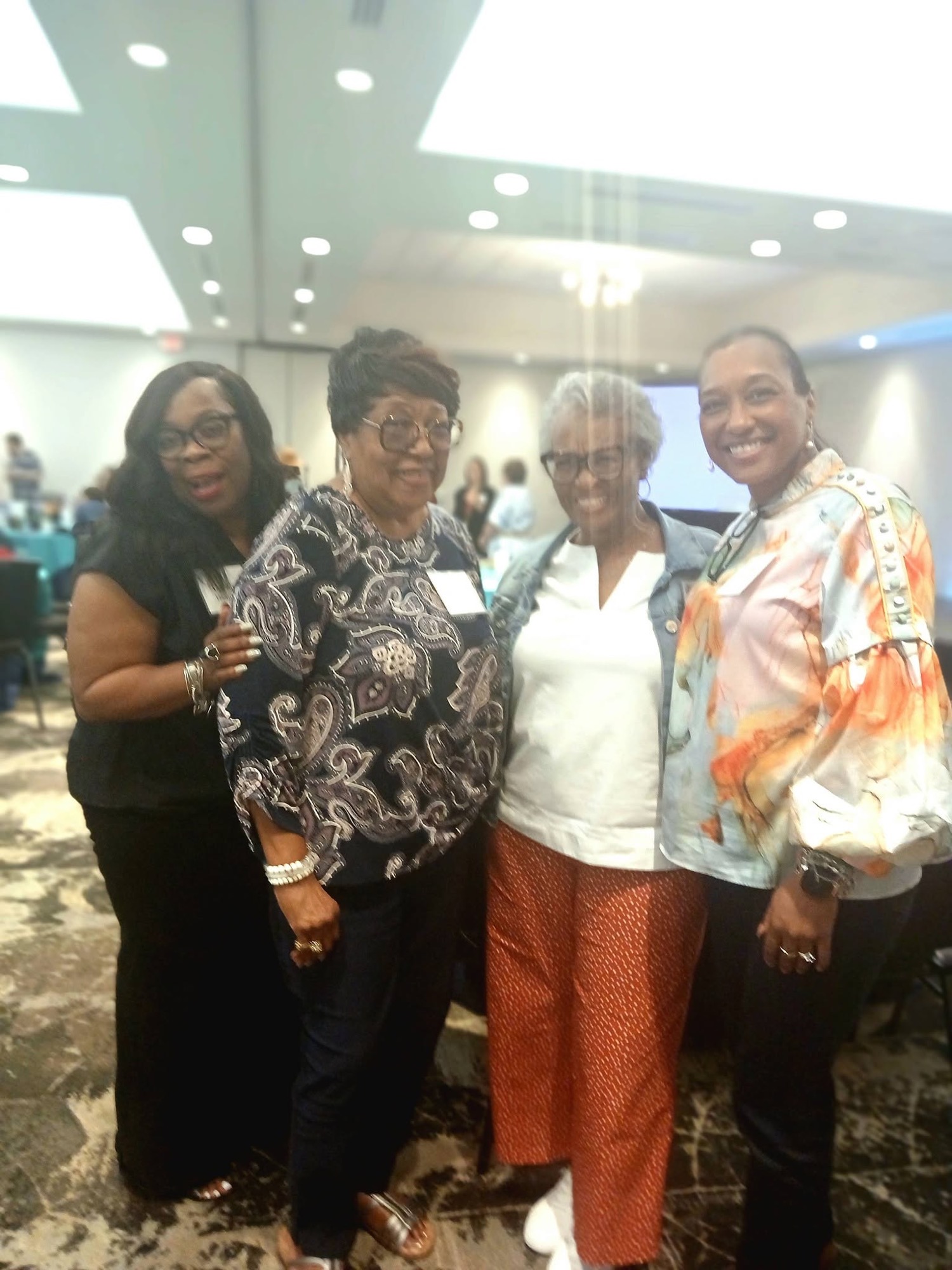 Group of women together at a past Be1 Experience