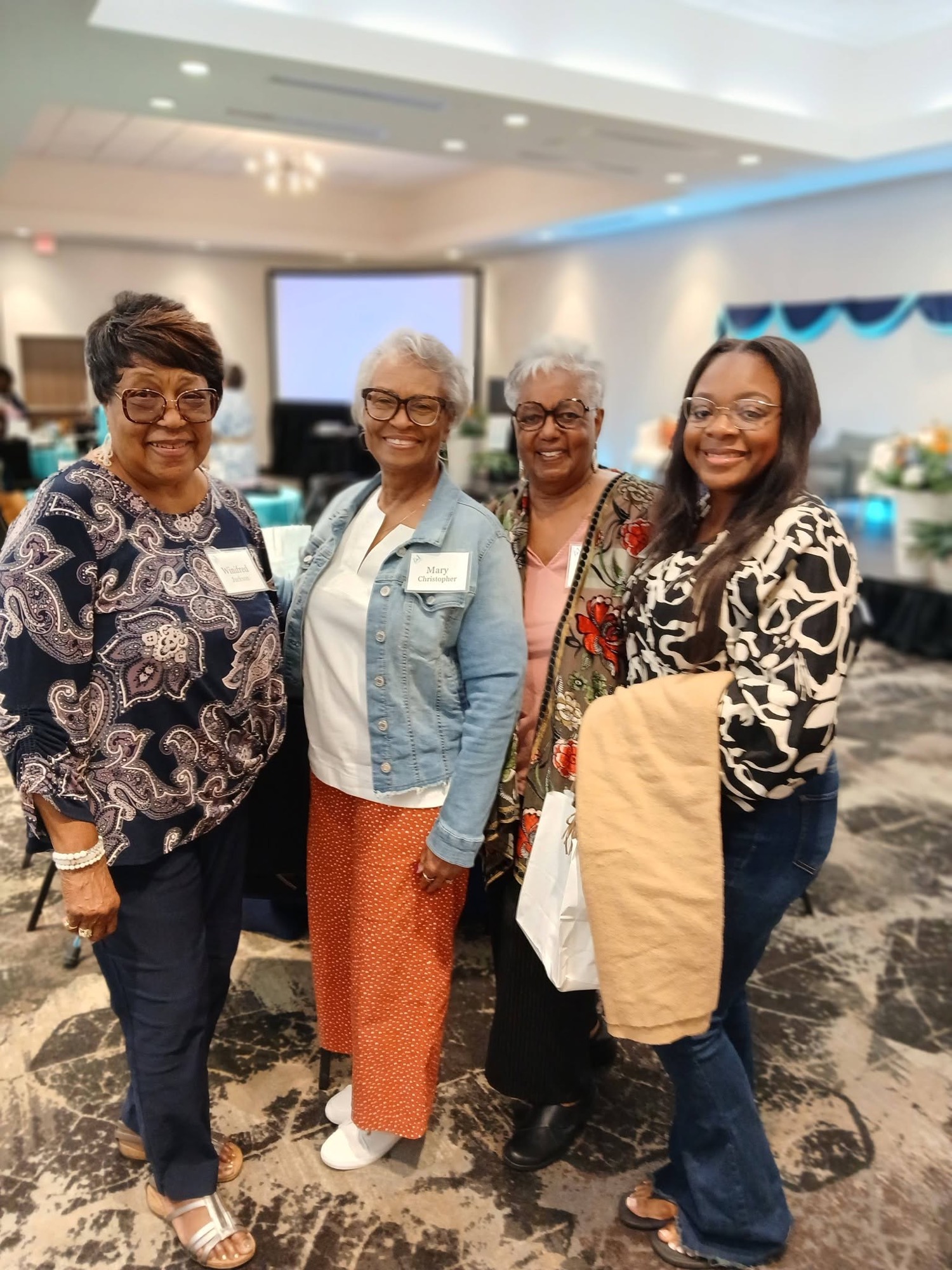 Group of women together at a past Be1 Experience